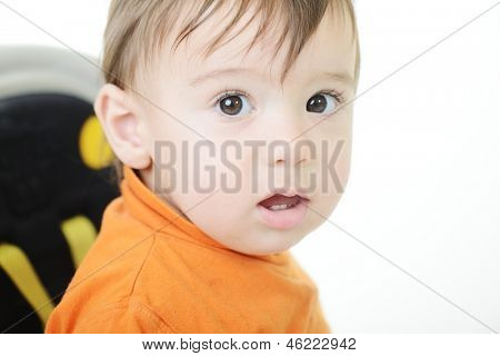 Baby kid with various funny poses isolated on white driving a car