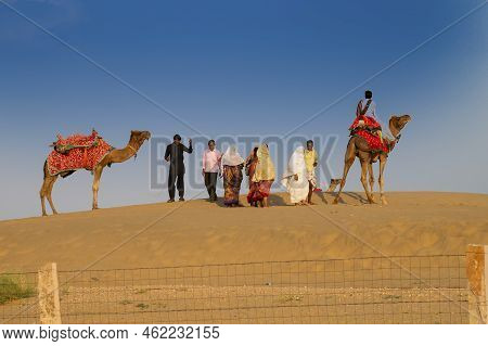Thar Desert, Rajasthan, India - October 15th 2019 : Tourists Riding Camels, Camelus Dromedarius, At 
