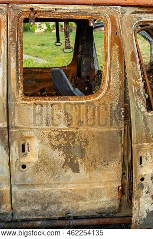 Damaged And Destroyed Civilian Car With Shrapnel Holes From Russian Missile In A War Zone In Kharkiv