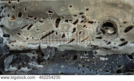 Damaged And Destroyed Civilian Car With Shrapnel Holes From Russian Missile In A War Zone In Kharkiv