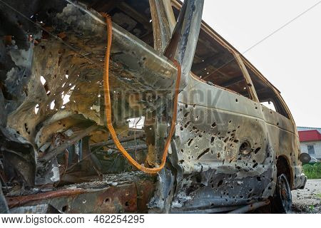 Damaged And Destroyed Civilian Car With Shrapnel Holes From Russian Missile In A War Zone In Kharkiv