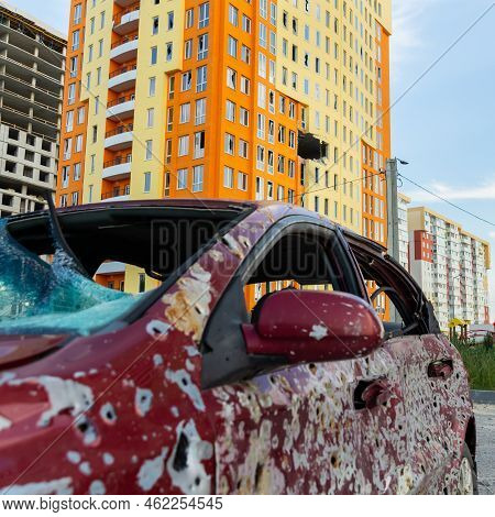 Damaged And Destroyed Civilian Car With Shrapnel Holes From Russian Missile In A War Zone In Kharkiv