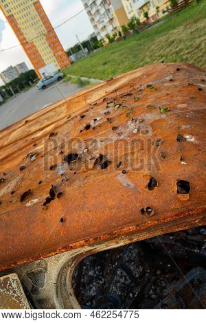 Burnt , Damaged And Destroyed Civilian Car With Shrapnel Holes From Russian Missile In A War Zone In