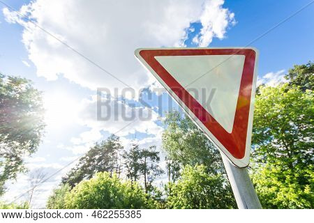 Give Way Sign On A Beautiful Sunset Background