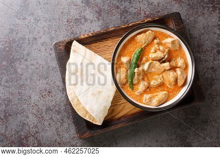 Spicy Kukul Mas Chicken Breast Curry With Coconut Milk And Spices Close-up In A Bowl On A Wooden Tra