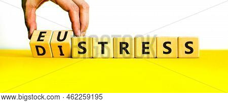 Eustress Or Distress Symbol. Psychologist Turns Cubes And Changes The Concept Word Eustress To Distr