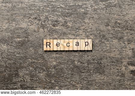 Recap Word Written On Wood Block. Recap Text On Table, Concept.