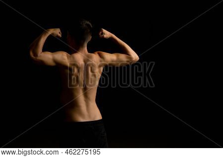 Shirtless 19 Year Old Teenage Boy Flexing His Back Muscles