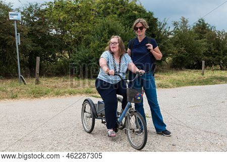 Hakendover, Flanders   Belgium - 07 25 2020: Portrait Of A Cute 38 Year Old Girl With Down Syndrome 