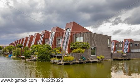 Ecological Houses With Integrated Solar Panels And Hanging Gardens On Waterfront In Urban Area Of Th