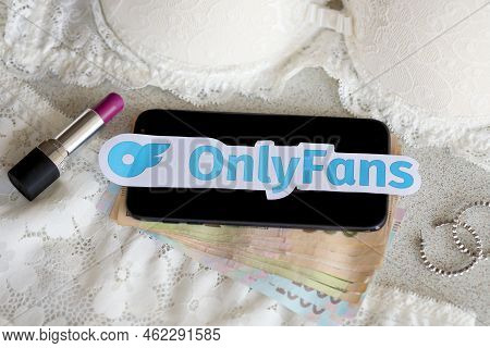 Ternopil, Ukraine - September 6, 2022 Onlyfans Paper Logotype Among Lipstick, Earrings And Women Lin