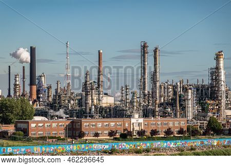 Antwerpen, Flanders, Belgium - July 10, 2022: Industry Along Scheldt River. Colorful Wall On Shoreli