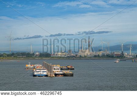 Antwerpen, Flanders, Belgium - July 10, 2022: Industry Along Scheldt River. Looking East Along Midst