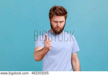 Portrait Of Strict Serious Young Bearded Man Warning Of Mistake, Looking At Camera With Admonishing 