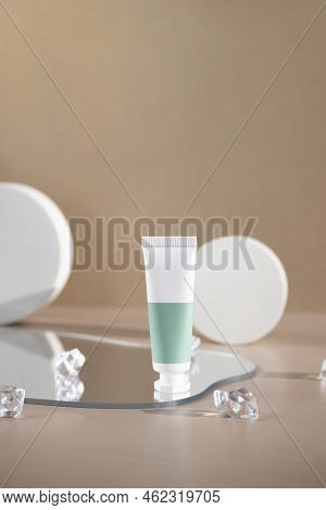 Packaging From A Cream Or Cosmetic Standing On A Mirror