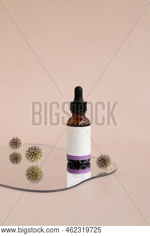 Packaging From A Cream Or Cosmetic Standing On A Mirror