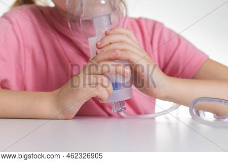 A 5-year-old Girl Breathes Into An Inhaler To Dilute Sputum In Case Of Lung Diseases. Treatment Of C