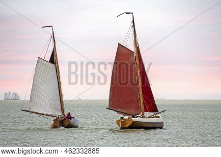 Traditional Dutch Wooden Boats At The Ijsselmeer In Friesland The Netherlands At Sunset