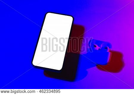 Mobile Phone Mockup In Pink And Purple Light.design Template For Concept Design. Modern Communicatio