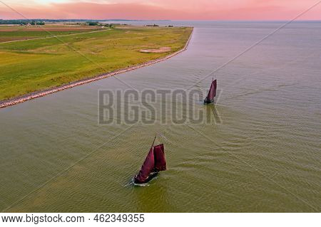 Aerial From Traditional Dutch Wooden Boats At The Ijsselmeer Near The Harbor From Laaxum In Frieslan