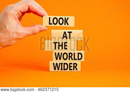 Look At The World Wider Symbol. Concept Words Look At The World Wider On Wooden Blocks On A Beautifu