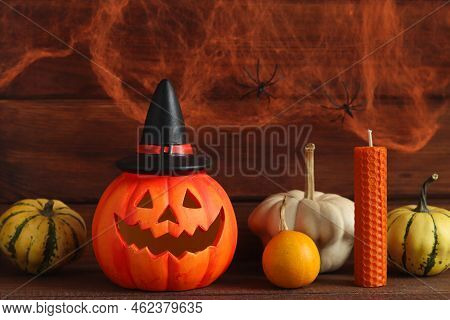 Halloween Postcard. Jack-o-latern With Decorative Pumpkins And Candle Against The Background Of A Co