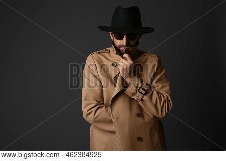 Exhibitionist In Coat And Hat On Black Background