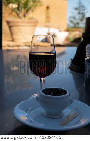 Tasting Of Red Wine By Old Wine Maker In Pierres Dorées Region With Yellow Stone Houses On South Of