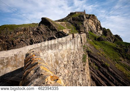 Stone Footpath To Famous Landmark And Film Location In North Of Spain, Ocean Islet With Chapel San J