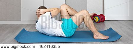 A Strong, Healthy Man With Muscles, Training At Home In The Plank Position. Fitness At Home. Banner.