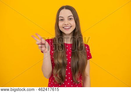 Cheaky Teen Girl Giving Victory Sign. Happy Teenager Child Smiling With V-sign, Positive Gesture, St