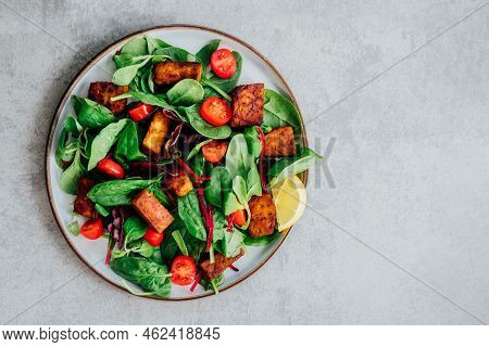 Top View Healthy Salad With Roasted Tempeh, Cherry Tomato, Beetroot Straws, Spinash And Lettuce Leav