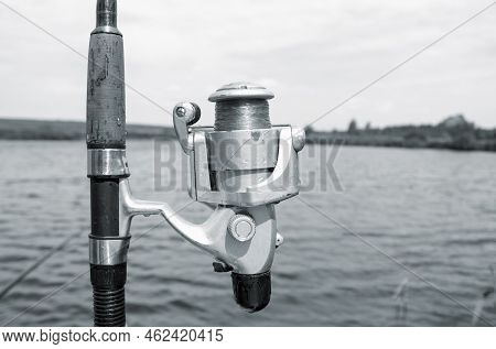 Spinning And Lake. Beach Surfcasting Spinning Fishing Reel And Rod.