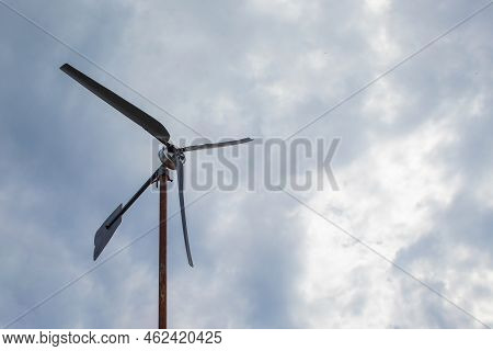 Small Wind Farm On The Roof Of The House. Wind Turbine As An Alternative, Wind Energy Converter, Cle