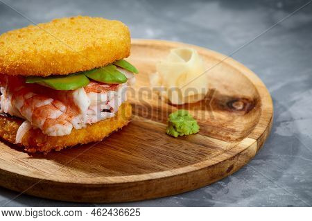Pan-asian Cuisine Concept. Japanese Sushi Burger Made From Rice Bread, Crab Meat, Lettuce And Wasabi