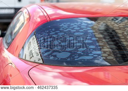 Rear Car Window With Old Adhesive Defective Dark Sunproof Tint Film In Air Bubbles. Mistake Wrong Ba