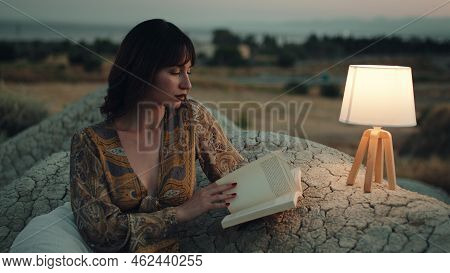 Beautiful Girl Enjoy The Sunset On The Mountain In The Evening With Abat Jour Lamp On The Stones
