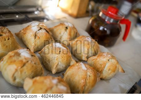 Making Apples Baked In Dough. Yummy Hot Pastry Items With White Sugar On Top On Baking Sheet