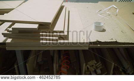 Board Chipboard Cut Parts For Furniture Production Close-up. Fragment Of A Wooden Panel Made Of Fibe