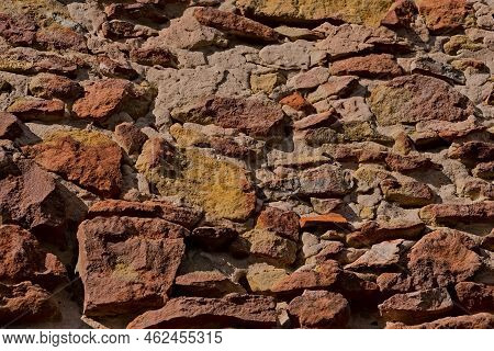 Beautiful, Old Wall (wall Of The House) Made Of Stone (sandstone) Combined With Lime Mortar. Colorfu