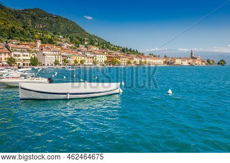 Idyllic Lake Garda Coastline And Mediterranean Village Of Toscolano Maderno With Sailboats And Mount
