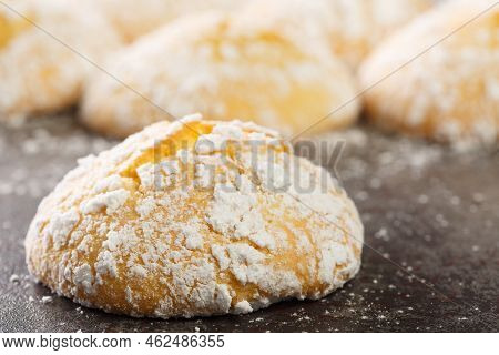 Homemade Cracked Lemon Cookies With Powdered Sugar And Zest Close-up On The Table. Horizontal