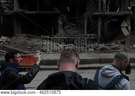 Kyiv, Ukraine, 04-29-2022: Three Journalists Work In The Building Where A Russian Army Rocket Fell I
