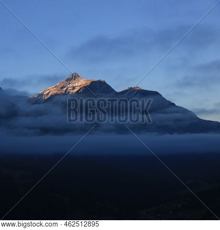 Sunlit Peak Of Mount Oldehore In Early Morning.