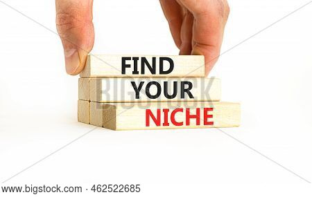 Find Your Niche Symbol. Concept Words Find Your Niche On Wooden Blocks. Businessman Hand. Beautiful 
