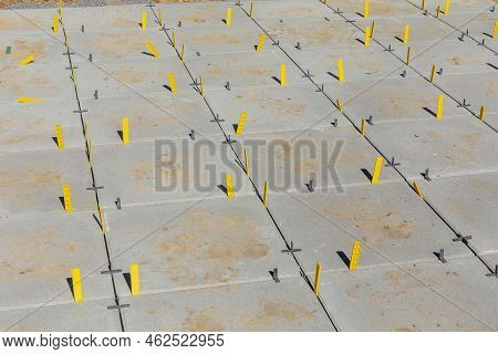 Detail Of Veranda Tiles With Yellow Distance Keeper.  The Yellow Plastic Spacers Have The Function O