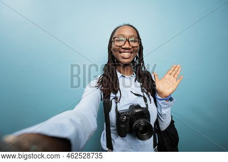 Happy Smiling Photographer With Dslr Camera Waving At Audience While Recording Daily Vlog Video. Exc