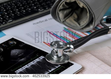 Using Digital Tablet, Doctor Checks Results Of Echocardiography Ultrasound The Heart Examination In 