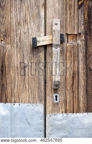 Unvarnished Antique Wooden Door With Metal Plate, Wood Texture