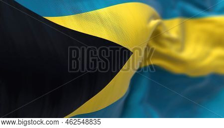 Close-up View Of The Bahamas National Flag Waving In The Wind. The Commonwealth Of The Bahamas Is A 